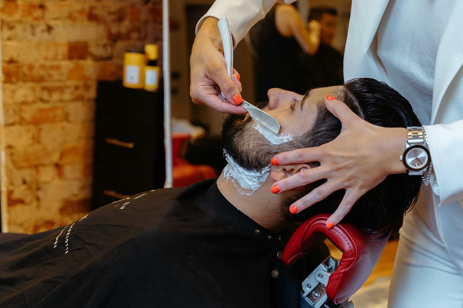 An Emerson Joseph customer getting a premium shaving experience 