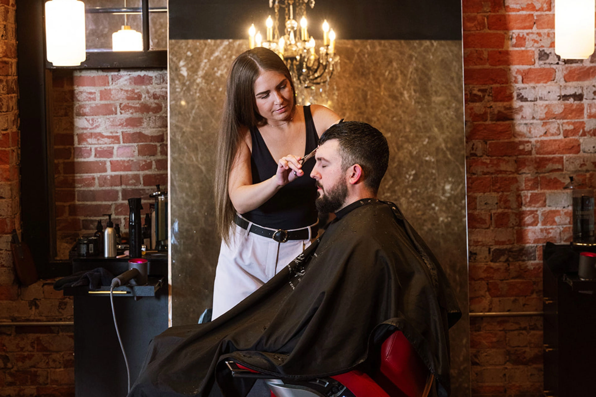 Young man getting a new haircut at Emerson Joseph